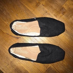 Black, fleece lined TOMS shoes